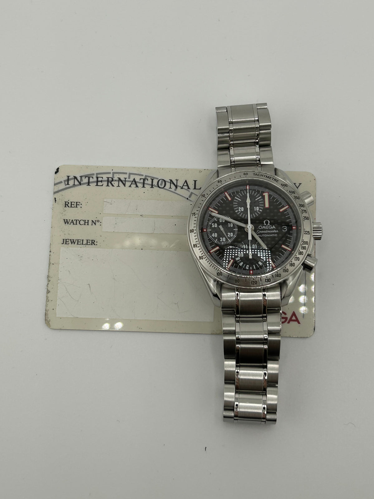 Omega Speedmaster Racing Black Dial on Stainless Steel Bracelet Ref. 3519.50.00 Card — view 8
