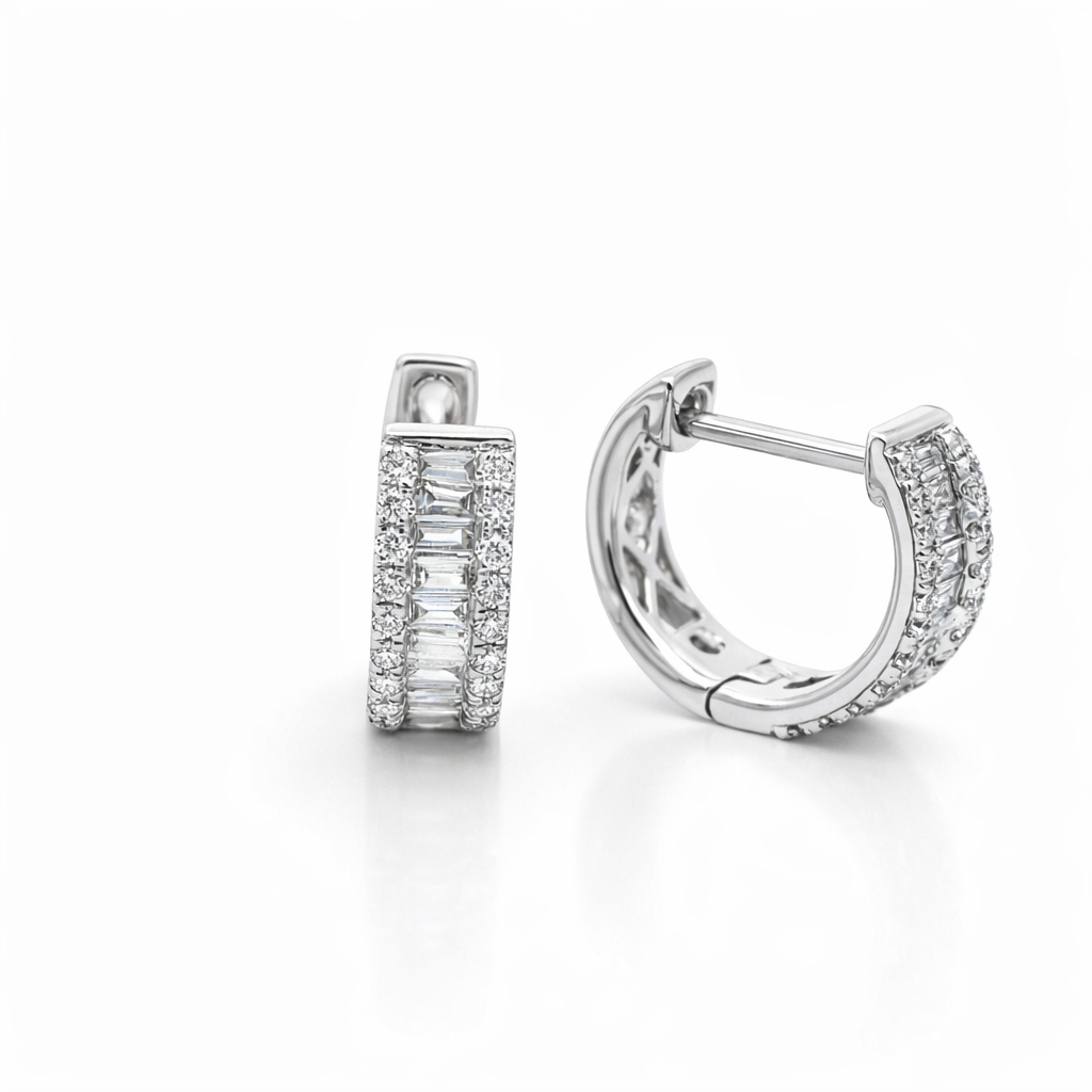 Pair of silver hoop earrings with diamond accents on a white background