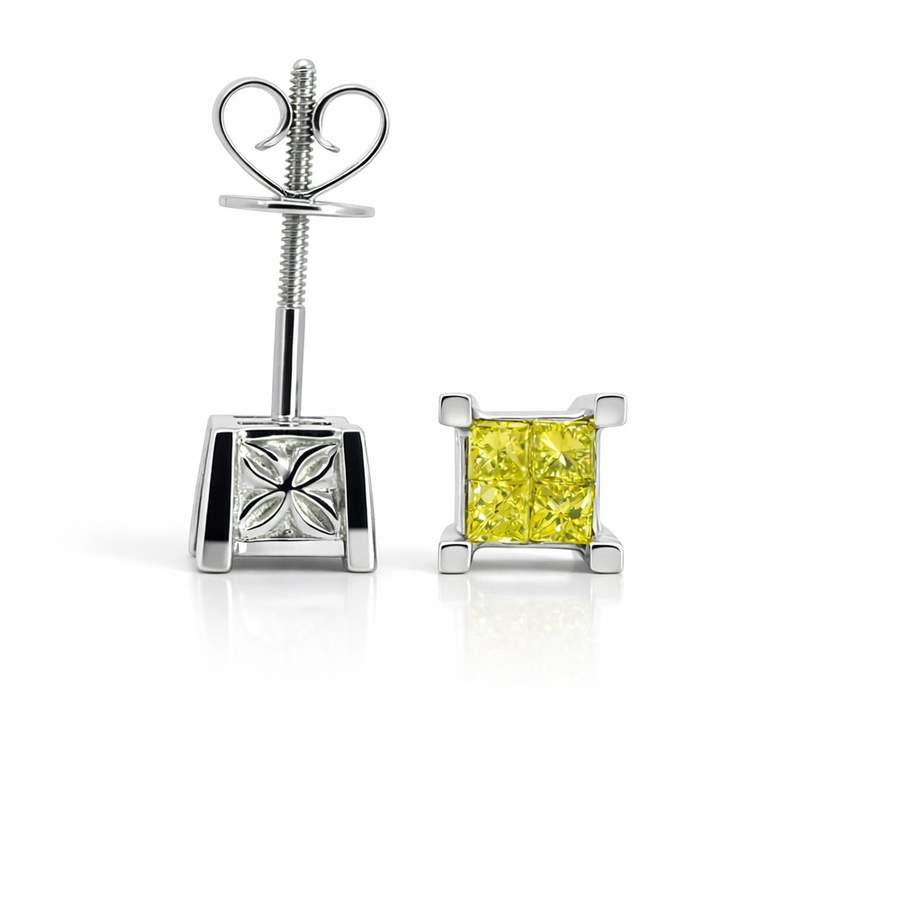 Pair of yellow diamond stud earrings on a white background