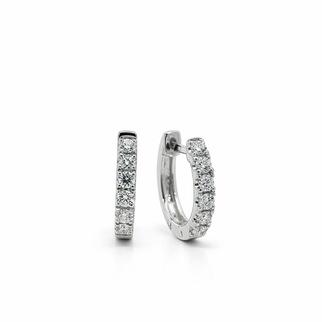 Pair of diamond hoop earrings on a white background