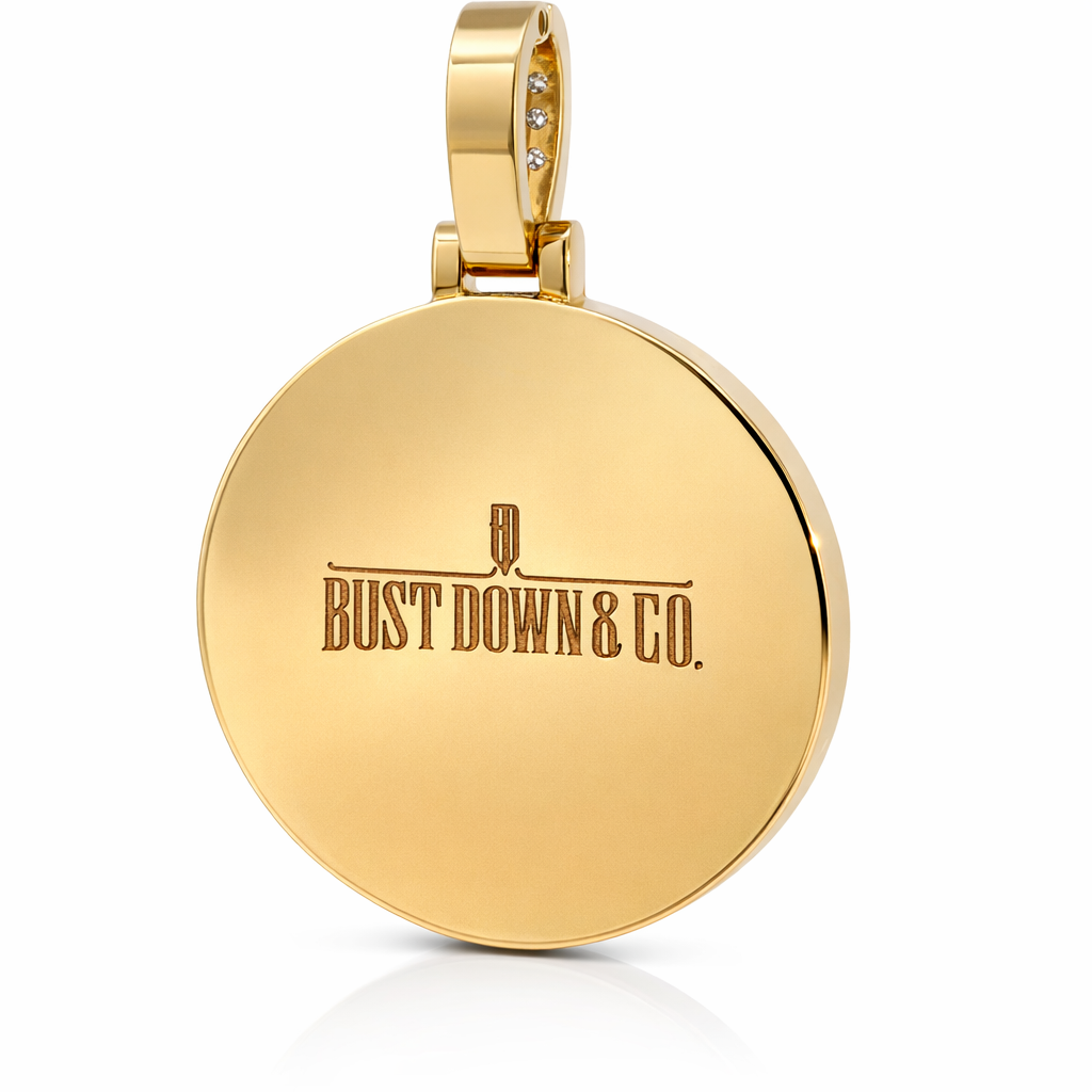 Gold pendant with 'Bust Down & Co.' engraving on a white background