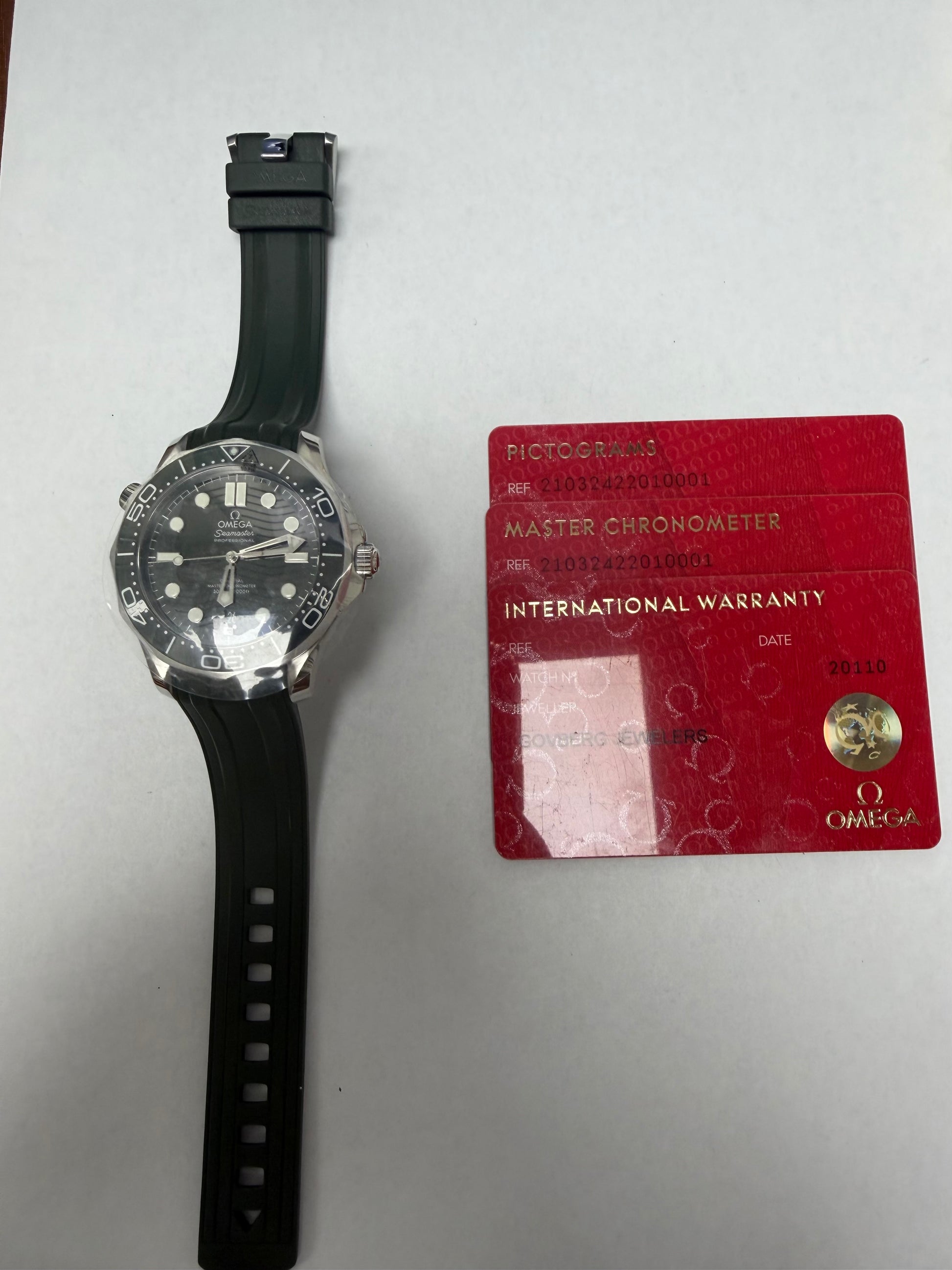 Omega Seamaster Diver 300M Co-Axial Master Chronometer Green Dial on Rubber Strap Ref. 210.32.42.20.10.001 Card Open Date — view 6
