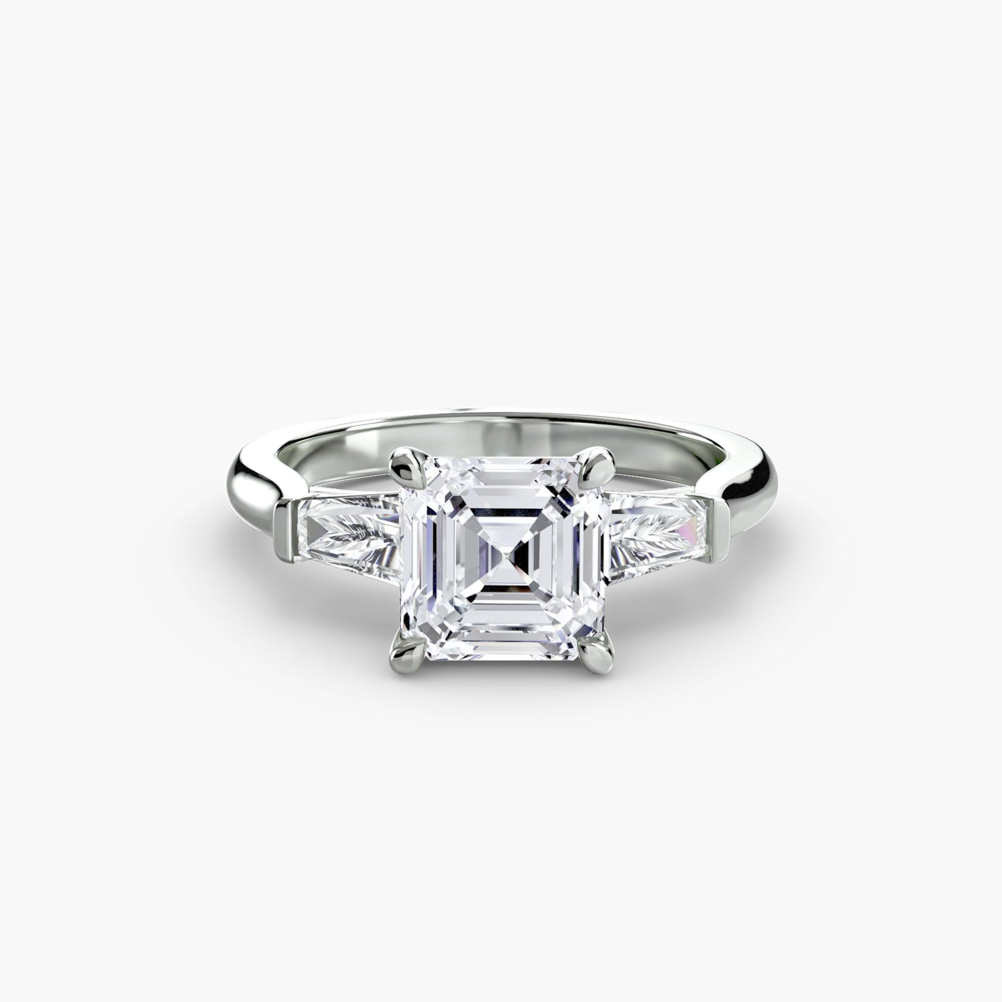 Anillo de tres piedras (piedras laterales baguette)