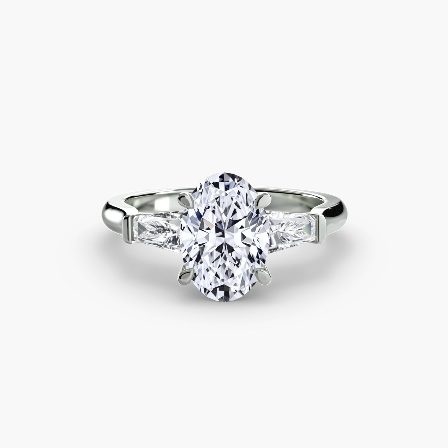Anillo de tres piedras (piedras laterales baguette)