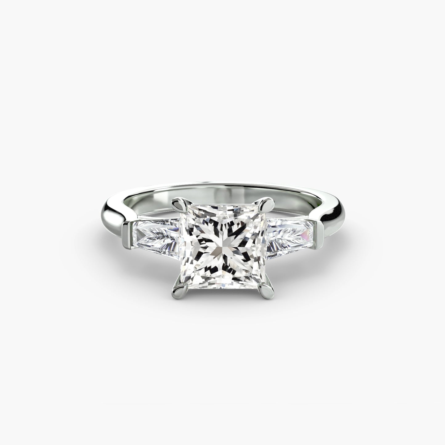 Anillo de tres piedras (piedras laterales baguette)