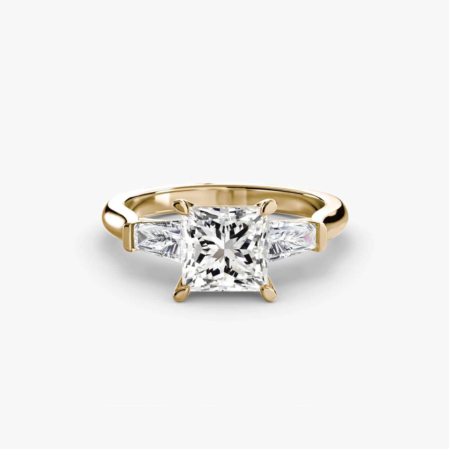 Anillo de tres piedras (piedras laterales baguette)