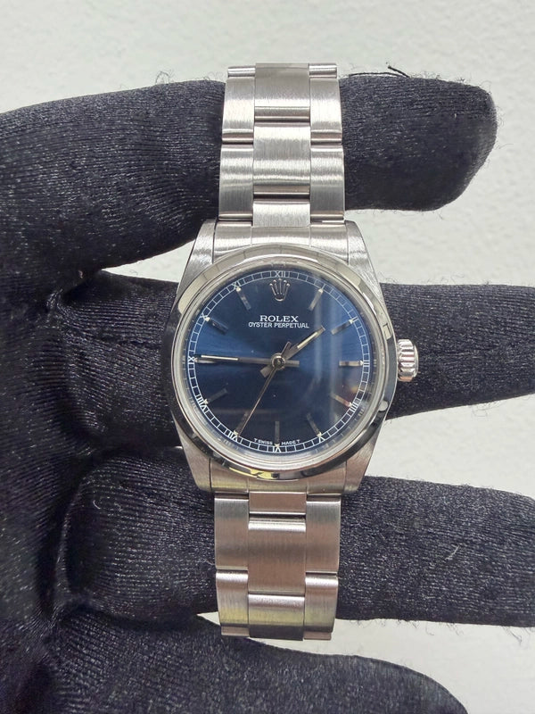 Rolex Oyster Perpetual Blue Stick Dial on Oyster Ref 67480 with Papers 1998
