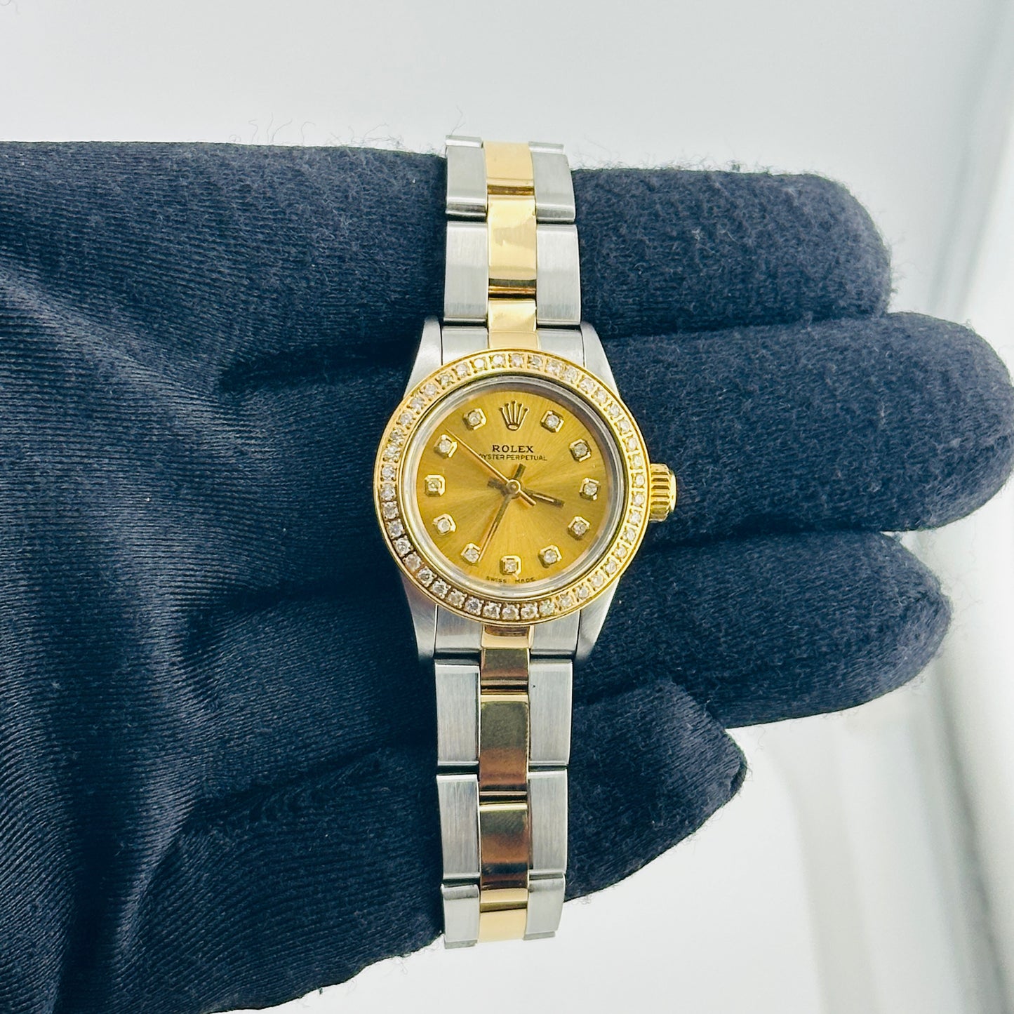 Rolex Oyster Perpetual Am Champagne / Yellow Diamond Markers Dial on Oyster Bracelet Ref. 67193 1990