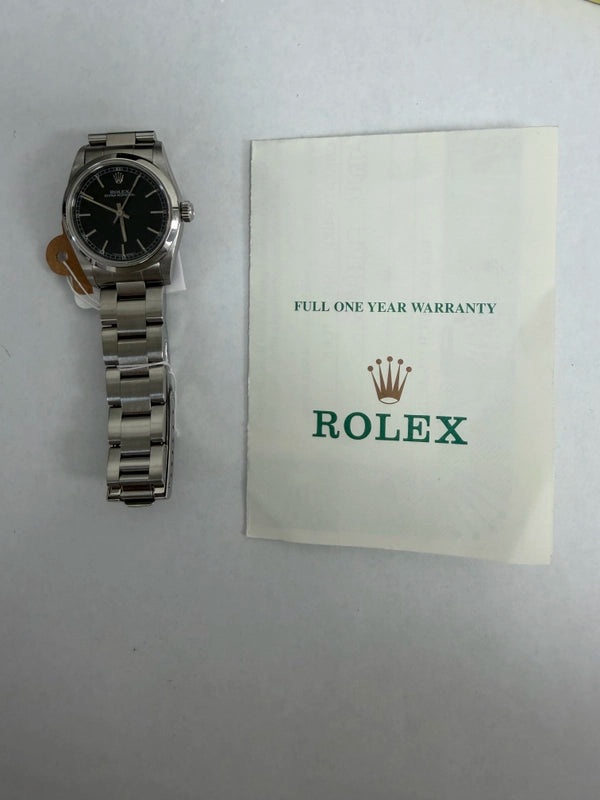 Rolex Oyster Perpetual Black Dial on Oyster Ref 67480 with Papers 1999